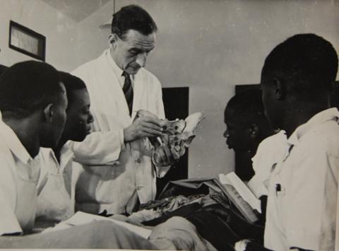 Dr A. Galloway (C) takes his students through an anatomy class, Medical School, Makerere University, Kampala Uganda