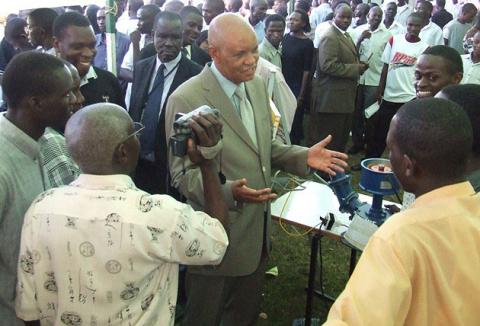 Chancellor Prof. Mondo Kagonyera interacts with Faculty of Technology students at the exhibition on Day 2 of the 3rd Stakeholders Consultative Conference, 26th to 27th March 2009, Makerere University, Kampala Uganda 