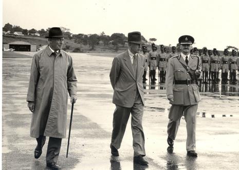 The Earl of Perth and Minister of State for Colonial Affairs (1957-62) Mr. J.D. Drummond inspects the Police Parade at Entebbe on 11th April 1959 during his tour of Uganda and Kenya