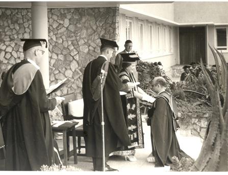 Her Majesty Queen Elizabeth, the Queen Mother then Chancellor University of London confers a Doctorate upon a Member of staff at Makerere Univeristy, Kampala Uganda, 20th February 1959