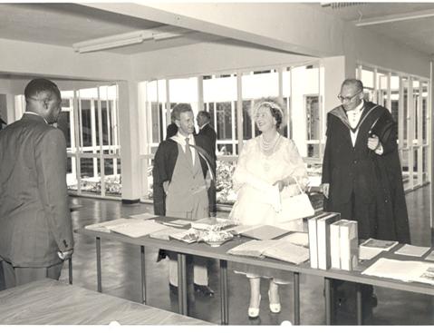 Her Majesty Queen Elizabeth, the Queen Mother, led by the Principal Sir Bernard de Bunsen tours the New Library Building at Makerere University, Kampala Uganda on 20th February 1959