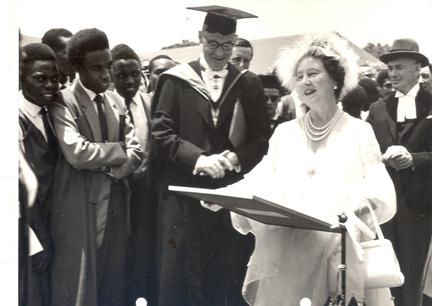 Her Majesty Queen Elizabeth, the Queen Mother and Principal Sir Bernard de Bunsen admire a framed portrait of the College at Makerere University, Kampala Uganda on 20th February 1959