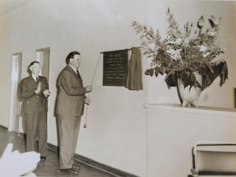Governor of Uganda Sir Andrew Cohen (R) unveils the tablet to officially open the Uganda Museum's new home at Kitante on 30th June 1954