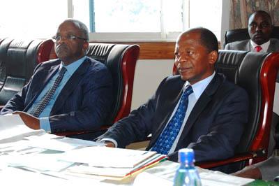 Hon Amama Mbabazi [L] and Hon John Chrysostom Muyingo [R] The Minister of State for Higher Education.