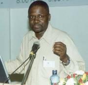 Prof. Joe Oloka-Onyango, Chairperson Organising Committee, gives the day's summary of discussions at the 2nd Stakeholders Consultative Meeting 26th April 2006, Makerere University, Kampala Uganda