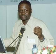 Prof. Joe Oloka-Onyango, Chairperson Organising Committee, gives the day's summary of discussions at the 2nd Stakeholders Consultative Meeting 26th April 2006, Makerere University, Kampala Uganda 