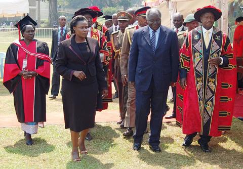 Education Minister Hon. Jessica Alupo (2nd L) leads H.E. Yoweri Kaguta Museveni (R) and H.E. Mwai Kibaki (2nd R) to unveil the plaque symbolizing the Launch of Constituent Colleges on 24th January 2012, Makerere University, Kampala Uganda. 