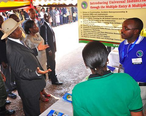 President Y.K. Museveni listens to Dr. Michael Kansiime, AFRISA, College of Veterinary Medicine, Animal Resources and BioSecurity (CoVAB) during his exhibition tour at the Kiira EV Launch, 24th November 2011, Makerere University, Kampala Uganda.