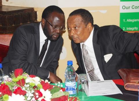 Hon. Prof. Peter Anyang' Nyong'o (L) confers with Rt. Hon. Prof. Apolo Nsibambi during the Re-launch of the Makerere Africa Lecture Series, 2nd December 2011, Makerere University, Kampala Uganda.