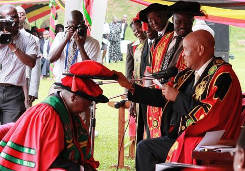 The Chancellor Prof. G.M. Kagonyera confers the Honorary Doctorate of Laws upon H.E. President Yoweri Kaguta Museveni on 12th December 2012, Makerere University, Kampala Uganda.