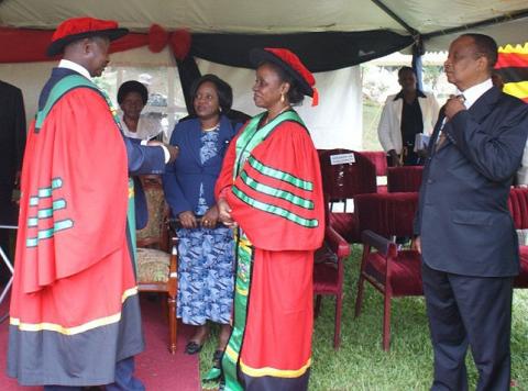 H.E. President Museveni chats with Ms. Zalia Kawawa (3rd R) and Ms. Rehema Kawawa (2nd R) alongside Rt. Hon. Apolo Nsibambi (R) and Hon. Namirembe Bitamazire (2nd L) after the Honorary Doctor of Laws Award Ceremony on 12th December 2010, Makerere University, Kampala Uganda.