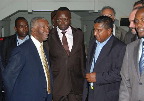 President Thabo Mbeki chats with Ag. Vice Chancellor Prof. Venansius Baryamureeba and some of the participants after the Public Q&A session on 19th January 2012, Makerere University, Kampala Uganda.
