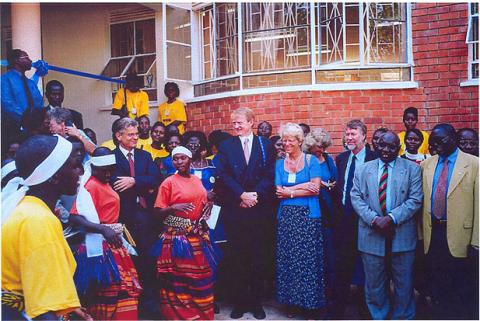 Vice Chancellor Prof. P.J.M. Ssebuwufu (2nd L), Director General NORAD, Ms. Tove Strand (C) and other officials enjoy entertainment at the official launch of the  Women and Gender Studies Building on 22nd July 2002, Makerere University, Kampala Uganda as part of the Women's World Congress 2002