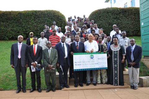 Guests pose for a group photo in front of the Main Bulding after the 2nd Joshua Mugyenyi Memorial Lecture, 15th March 2013, Makerere University, Kampala Uganda.