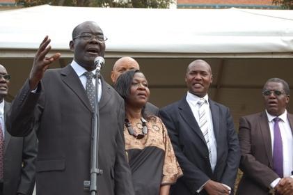 Mr. Mutekanga Igaga (L) accompanied by his wife Frances Mutekanga (2nd L) and family members thrills the congregation with a tenor of the Makerere Anthem during the Mak@90 Grand Finale Celebrations, 3rd August 2013, Freedom Square, Makerere University, Kampala Uganda.