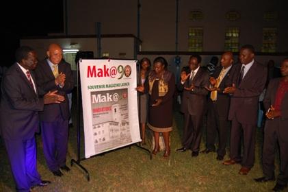 L-R: Chairperson-Council Eng. Dr. C. Wana-Etyem, Chancellor-Prof. G. Mondo Kagonyera, Vice Chancellor-Prof. J. Ddumba-Ssentamu (4th R) and the New Vision Team applaud as the Education Minister Hon. Jessica Alupo launches the Mak@90 Souvenir Magazine during the UEA celebrations, 29th June 2013, Makerere University, Kampala Uganda.
