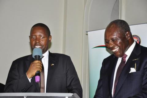 The University Secretary Mr. David Kahundha Muhwezi (L) and Former UEA Council Chairperson Dr. Martin Aliker announce the award winners at the UEA 50th Anniversary celebrations 29th June 2013, Makerere University, Kampala Uganda.